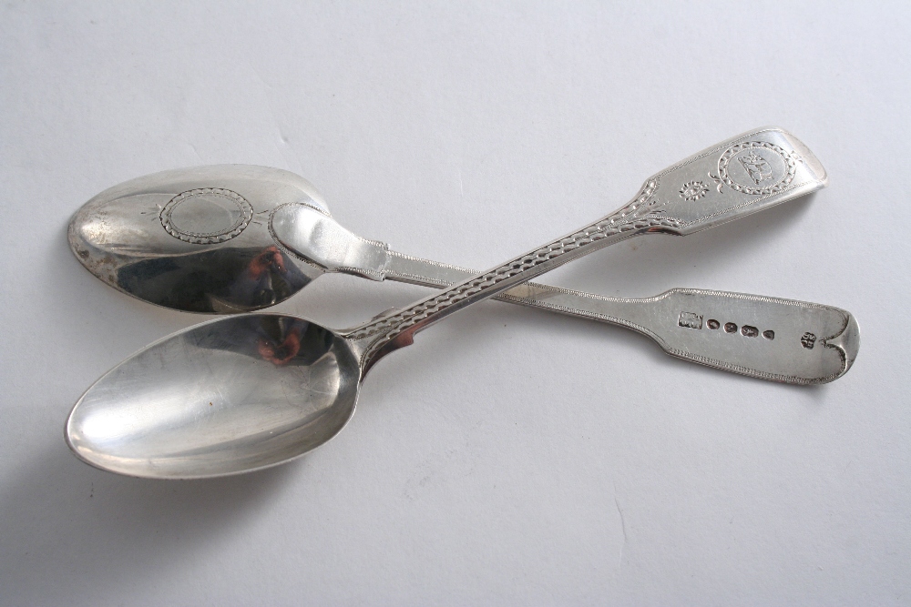 A SCARCE PAIR OF EARLY VICTORIAN PROVINCIAL TEA SPOONS bright-engraved Fiddle pattern, crested, by