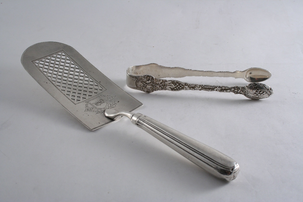 A GEORGE III FISH SLICE with a loaded, Thread pattern handle and pierced trellis work on the