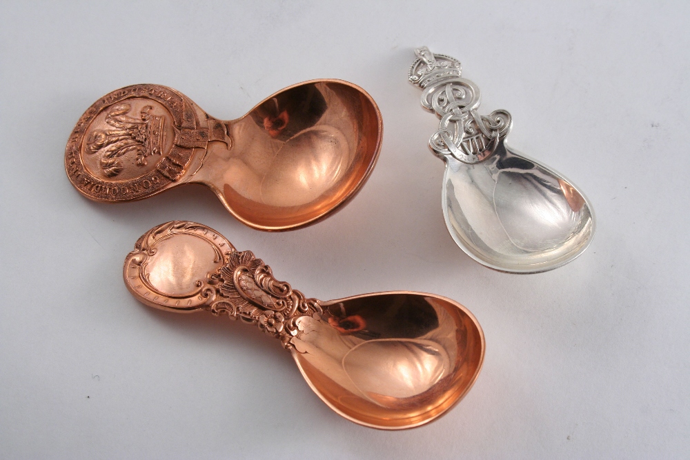 A COPPER CADDY SPOON stamped on the handle with the Prince of Wales`s Feathers & the motto "