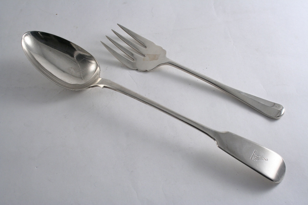 A GEORGE IV FIDDLE PATTERN BASTING SPOON crested, by Charles Eley, London 1824 and a modern