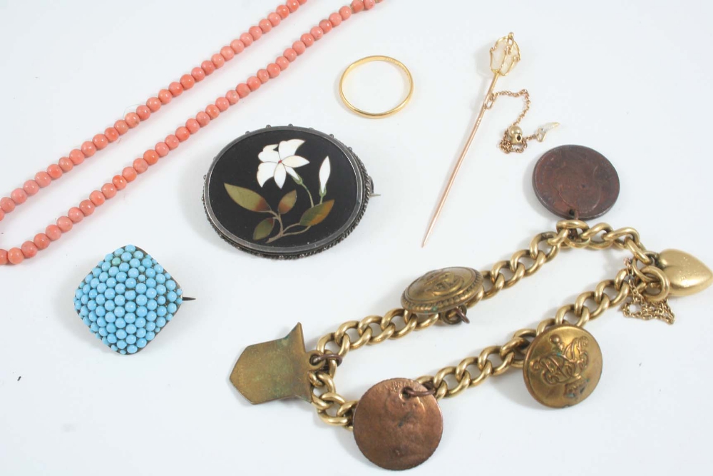 A QUANTITY OF JEWELLERY including an 18ct. gold curb link bracelet set with various charms, a brooch