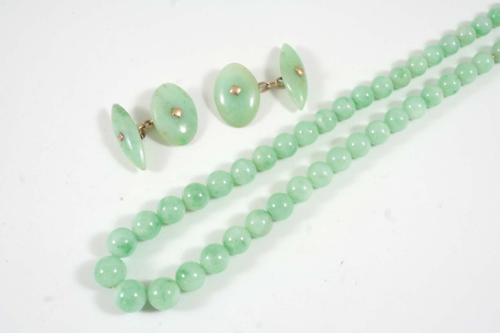 A GRADUATED JADE BEAD NECKLACE the beads graduate from 4mm. to 9.2mm., 67cm. long., together with