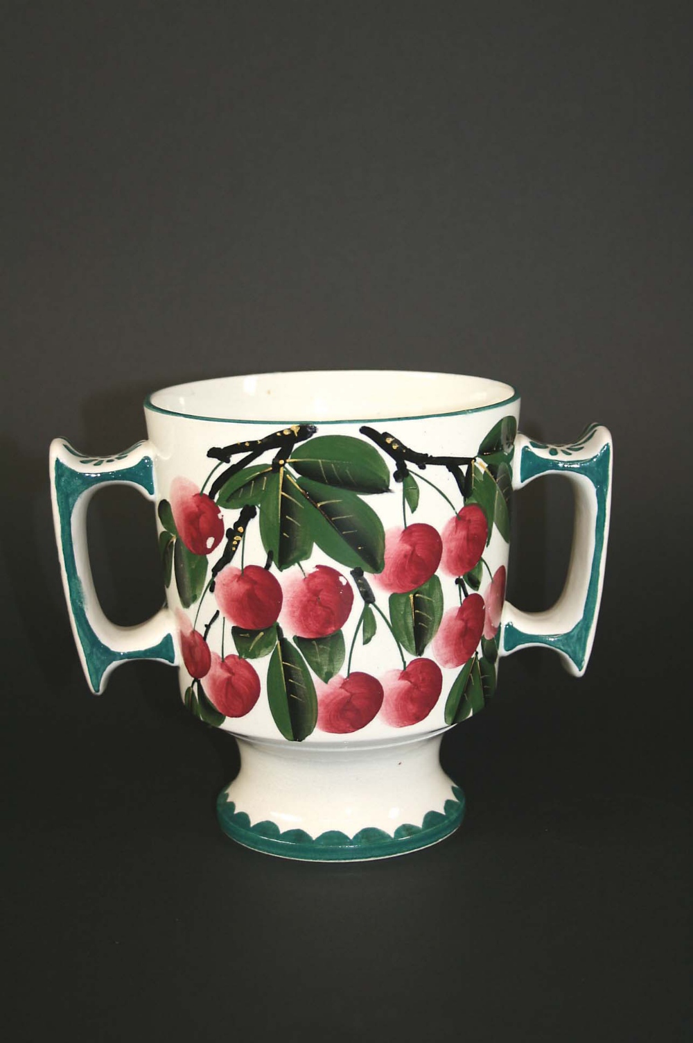 WEMYSS VASE painted with Cherries and leaves, and painted green borders. Painted mark, Wemyss. 6 1/