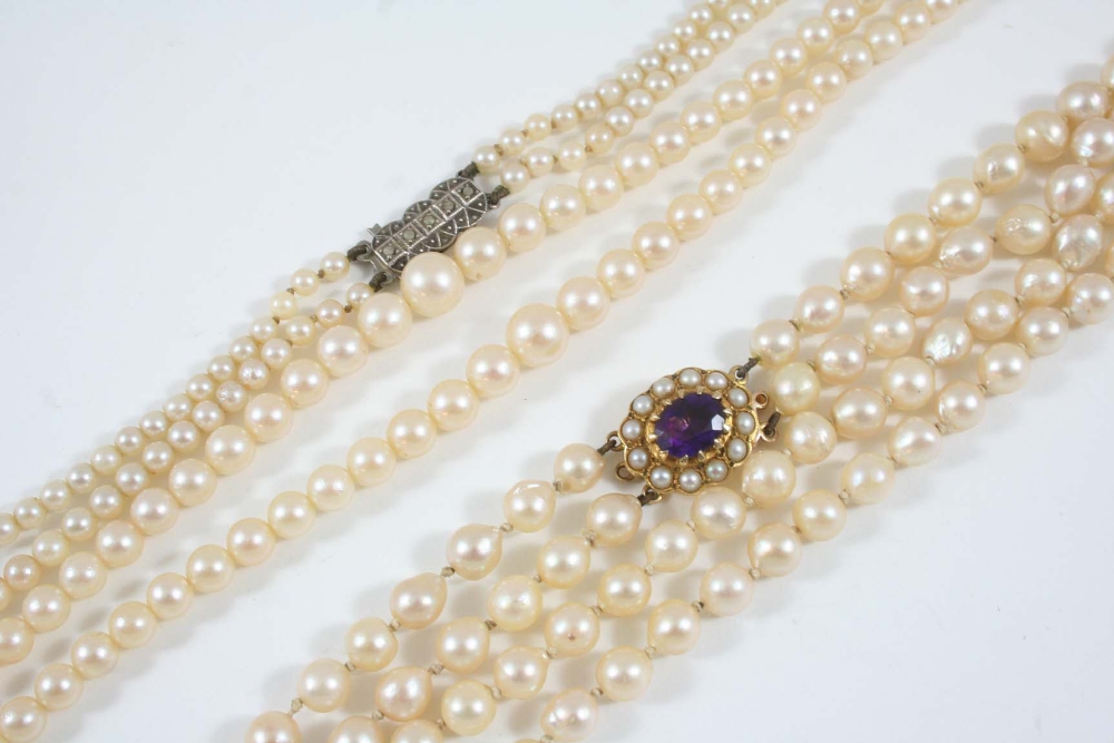 A TWO ROW GRADUATED CULTURED PEARL NECKLACE the pearls graduate from approximately 5.6mm. to 7.