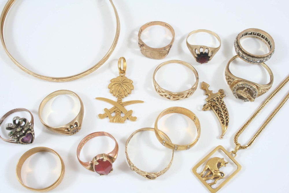 A QUANTITY OF GOLD JEWELLERY including a 9ct. gold bangle, an 18ct. gold pendant, and various gold