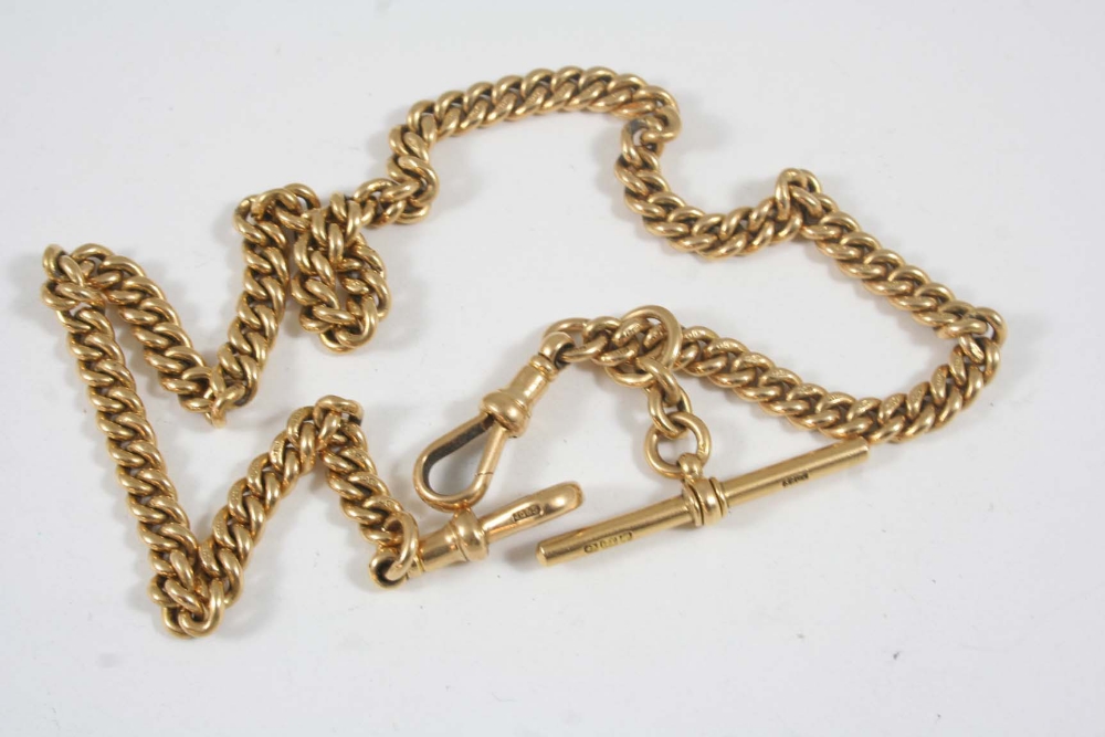 AN 18CT. GOLD WATCH CHAIN suspending a gold `t` bar, 36.5cm. long, 52 grams.