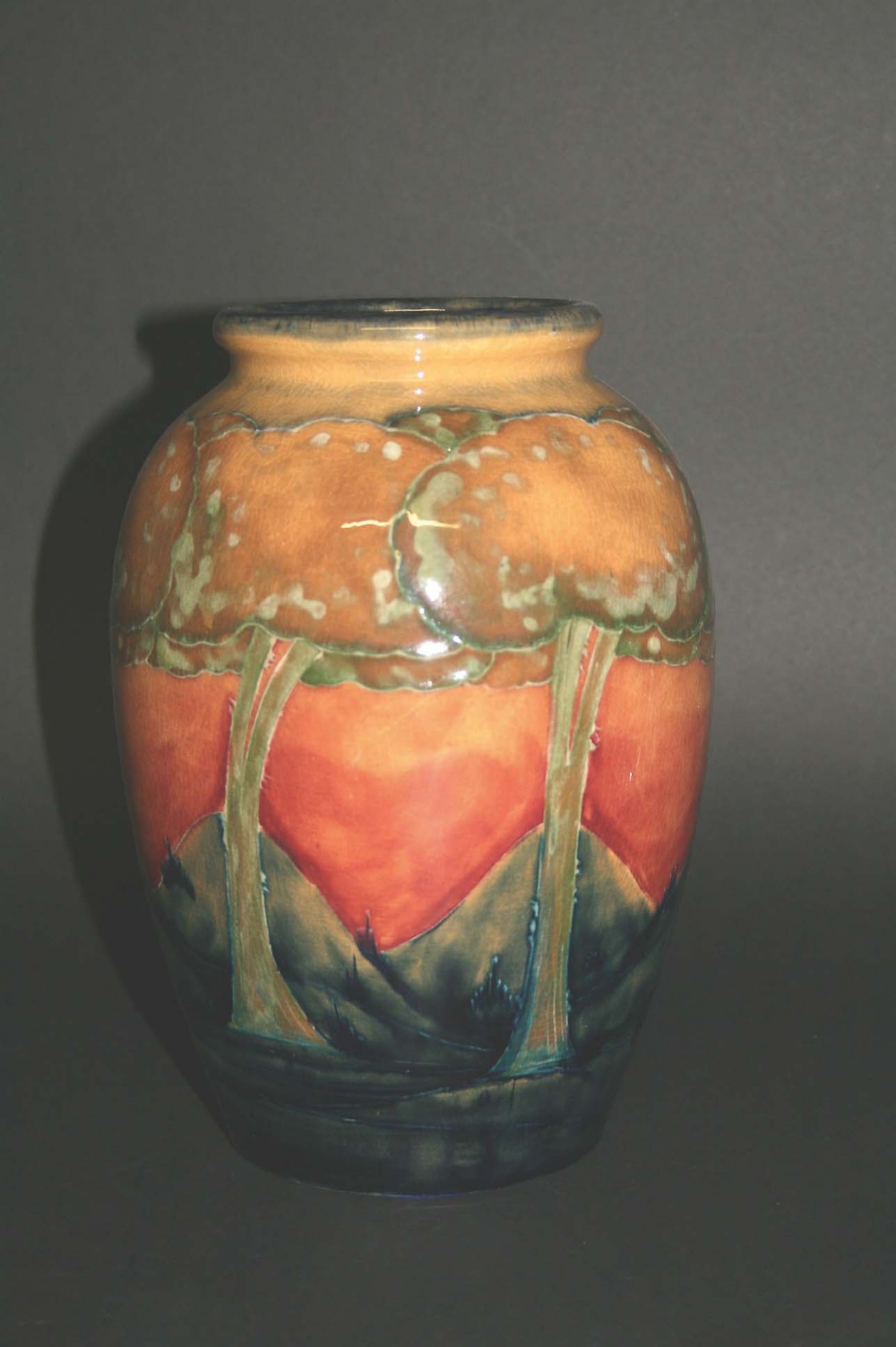 MOORCROFT VASE - EVENTIDE the vase painted with stylised trees in a landscape, circa 1925. Marked,