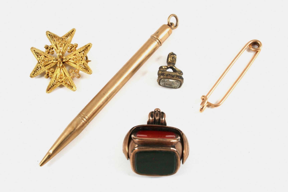 A 9CT. GOLD PROPELLING PENCIL BY S. MORDAN & CO. together with a gold tie pin, a spinning fob seal