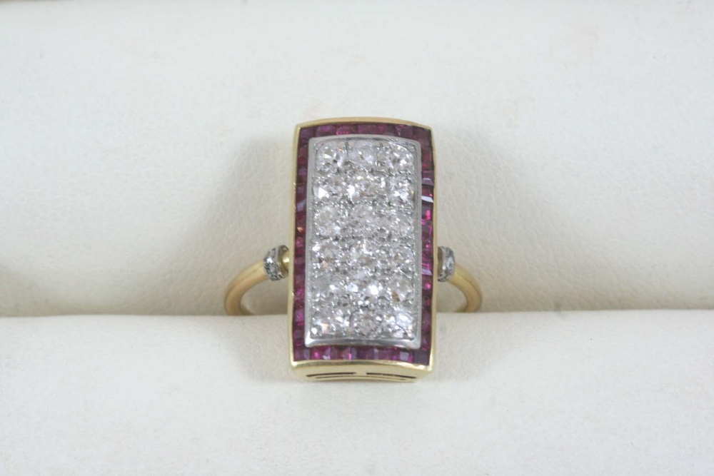AN ART DECO RUBY AND DIAMOND RING the central plaque is millegrain set with old brilliant-cut