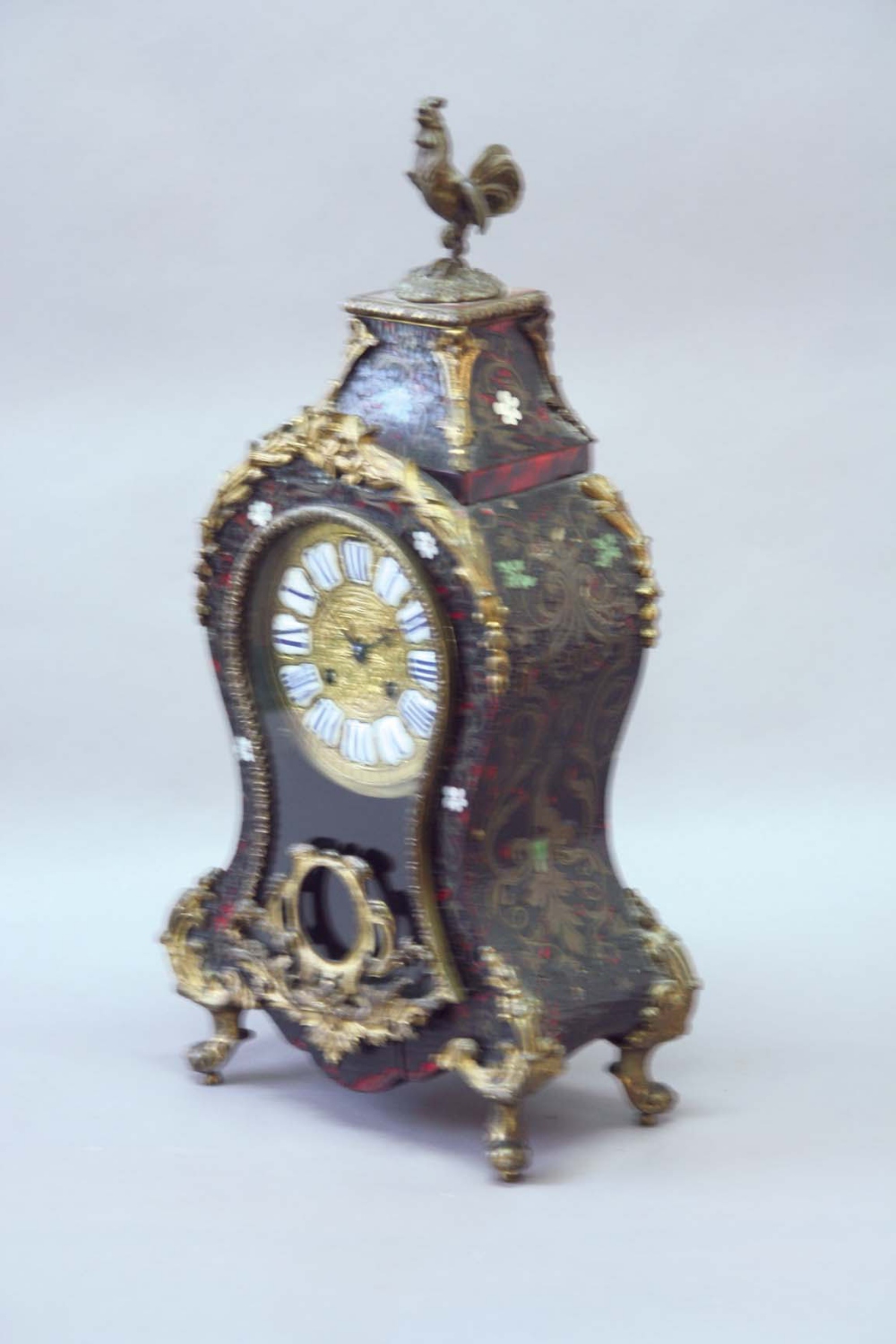 A BOULLE MANTEL CLOCK dial blue and white enamel numerals, movement drum striking on a bell, case