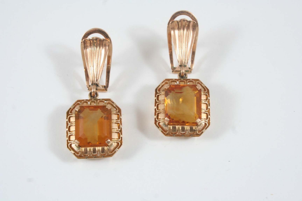 A PAIR OF CITRINE AND GOLD DROP EARRINGS each set with a rectangular-shaped citrine in 18ct. gold.