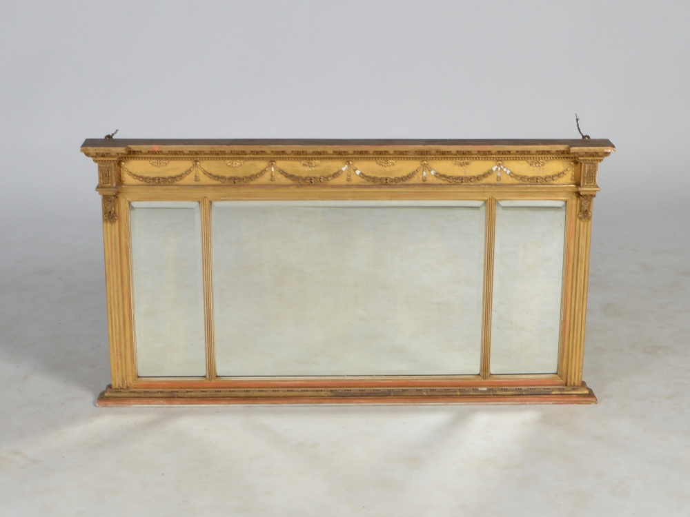 A late 19th century Regency style gilt wood overmantel mirror, the frieze decorated in relief with