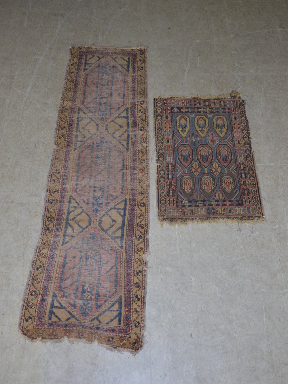 An Eastern runner and a small rug, the runner, 255cm x 78cm, the rug 118cm x 77cm.