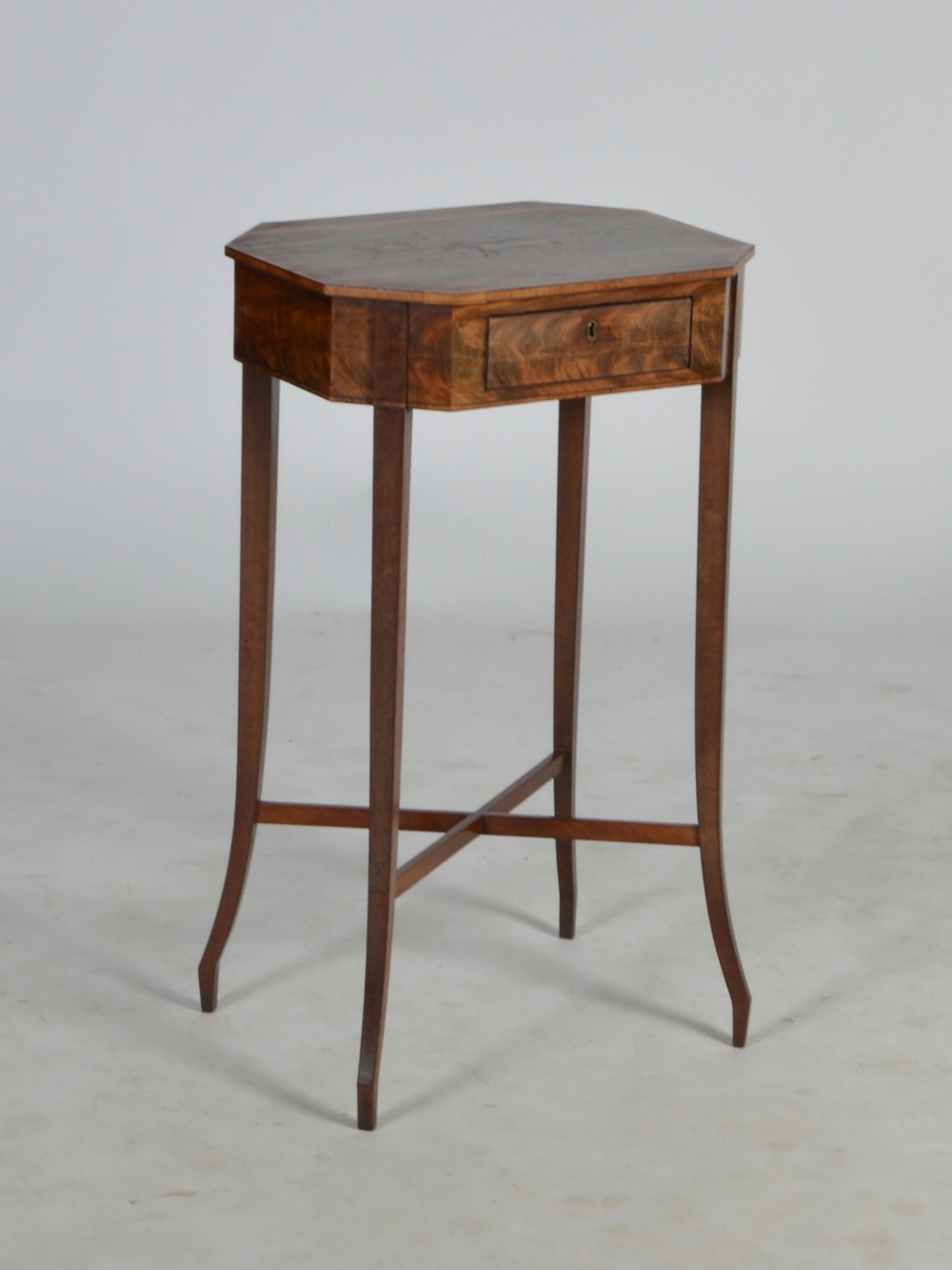 A 19th century mahogany and ebony lined occasional table, the octagonal shaped top above a frieze