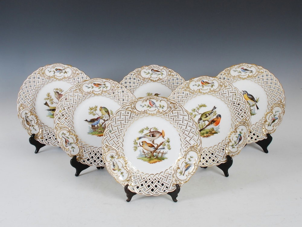 A set of six Meissen porcelain ornithological decorated dessert plates, decorated with colourful