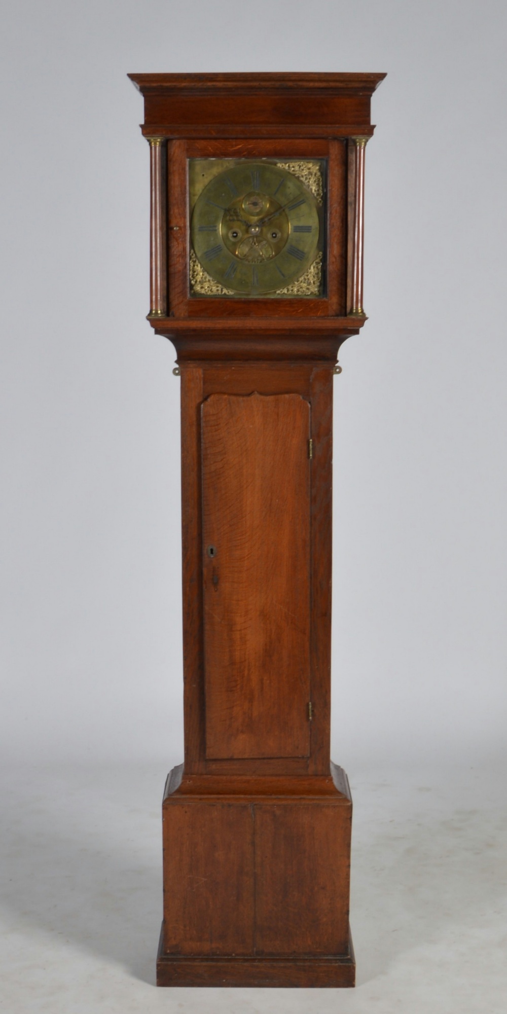 An 18th century oak longcase clock, Robt. Williamson, London, the 11" square dial with circular