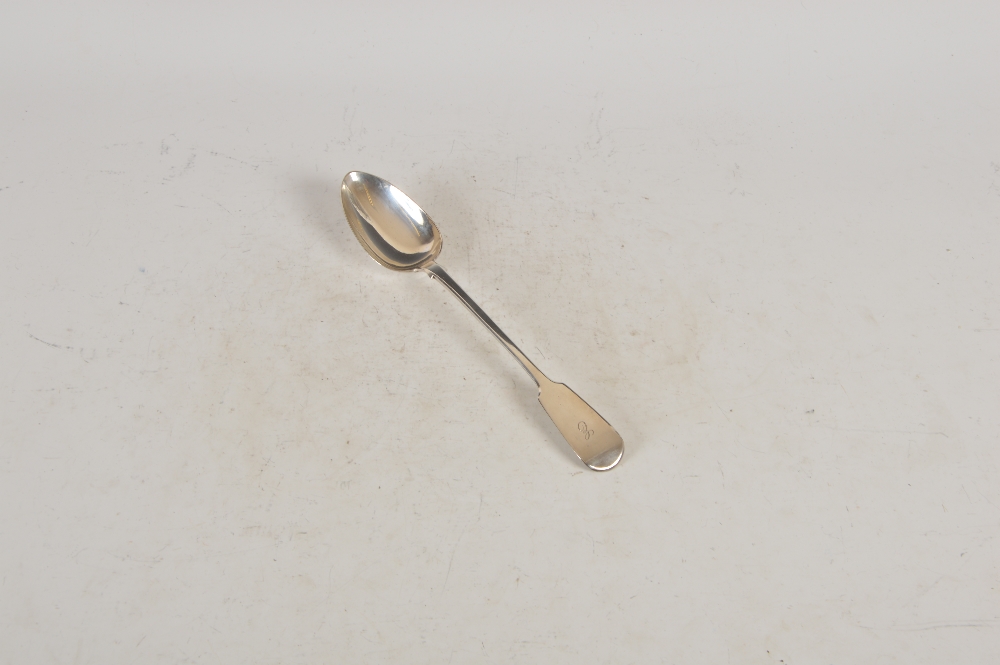 A George IV silver serving spoon, London, 1823, makers mark of WC, fiddle pattern, the terminal