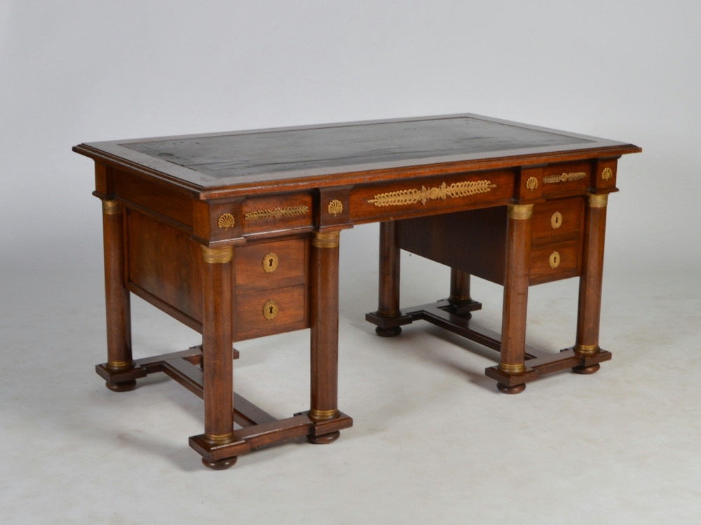 An early 20th century Continental Empire style mahogany and gilt metal mounted desk, the rectangular