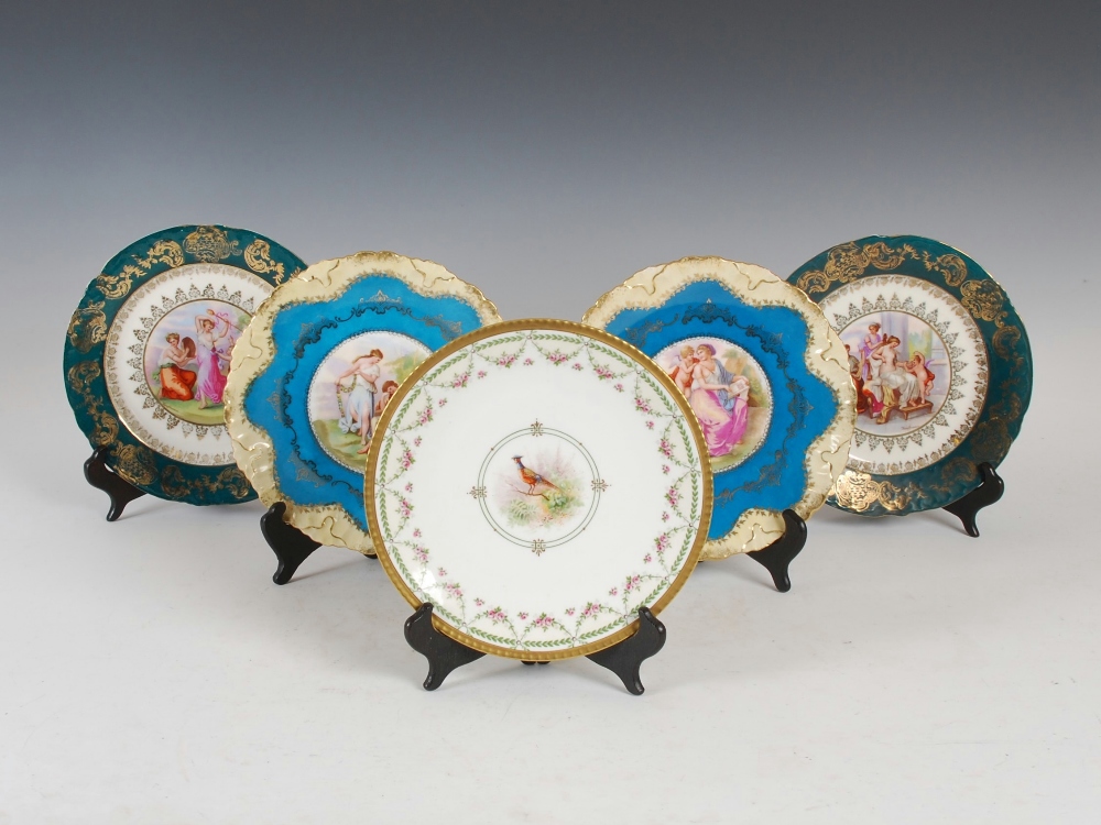 A collection of five Continental porcelain cabinet plates, comprising; a pair of green ground