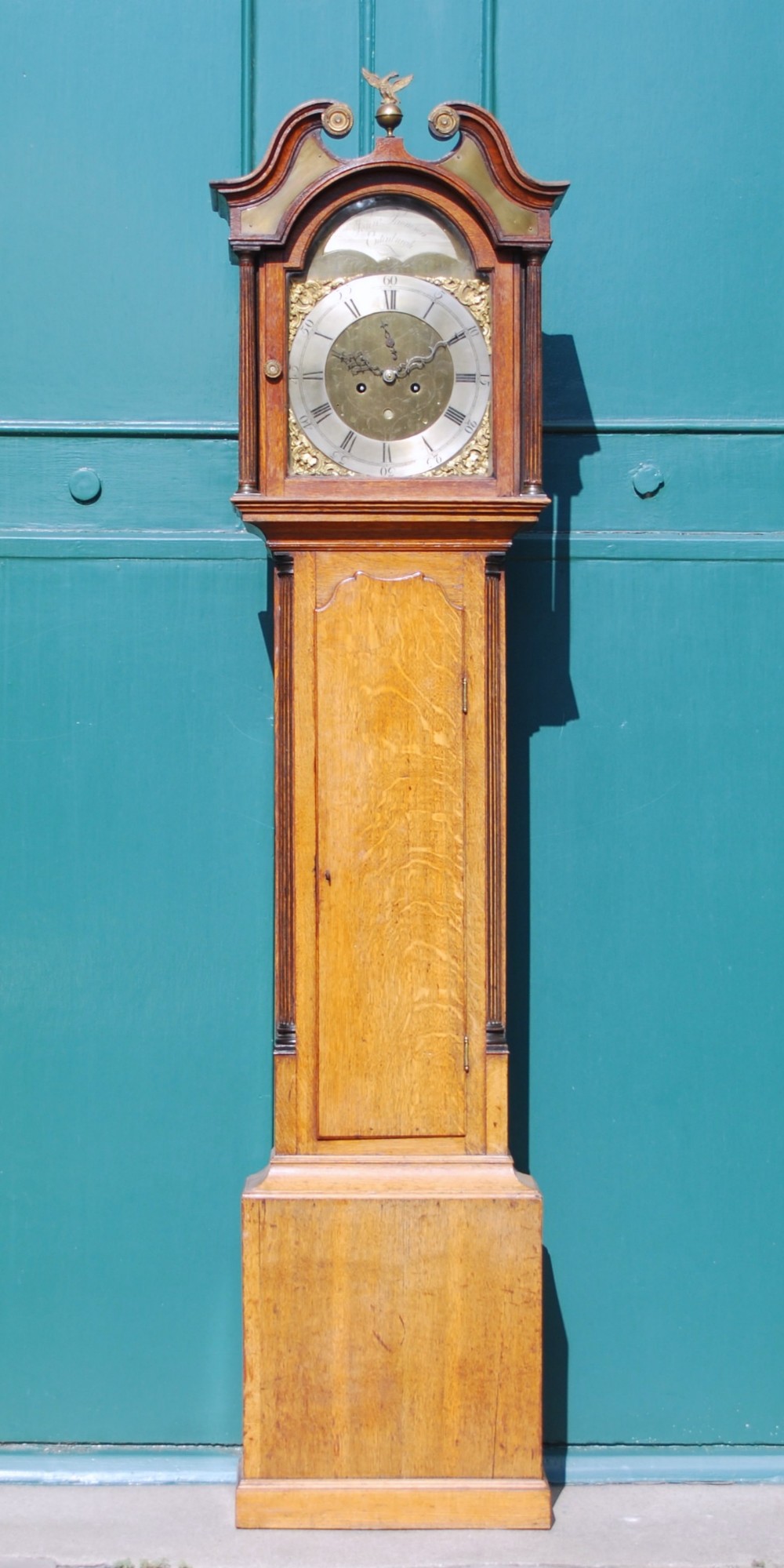 An 18th/ 19th century oak longcase clock, John Thomson, Edinburgh, the 12½" brass dial bearing a