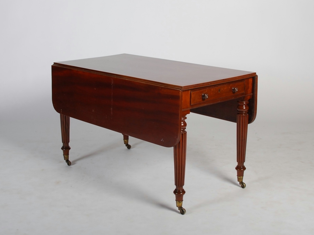 A William IV mahogany Pembroke table, the rectangular top with moulded angles and reeded edge, above