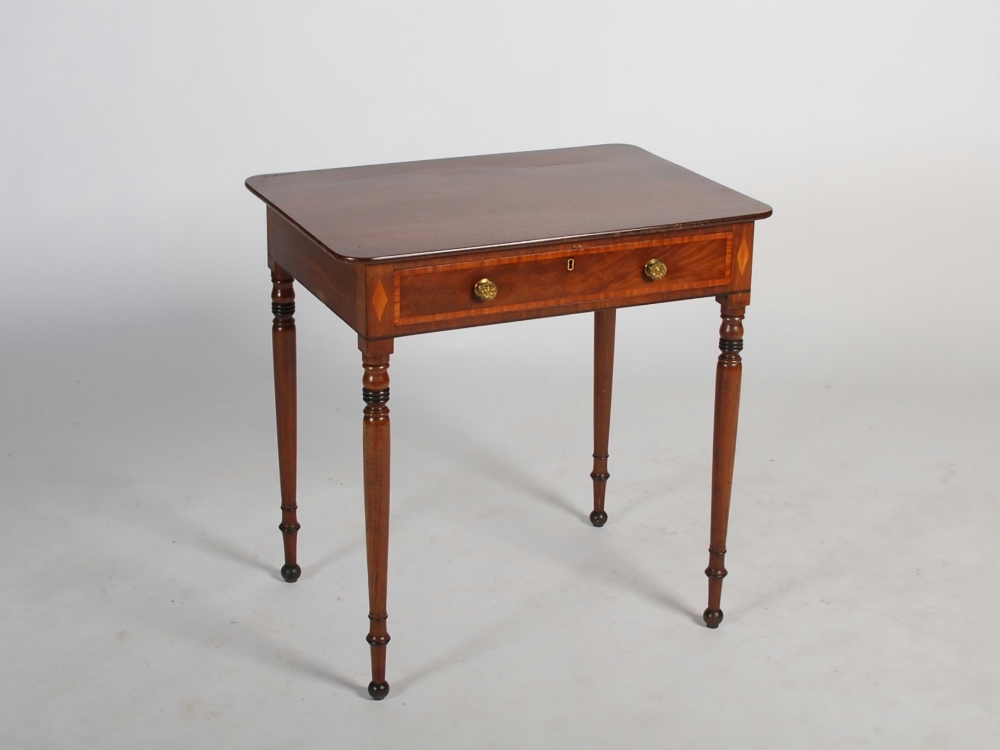 A Victorian mahogany and satinwood banded side table, the rounded rectangular top above a long