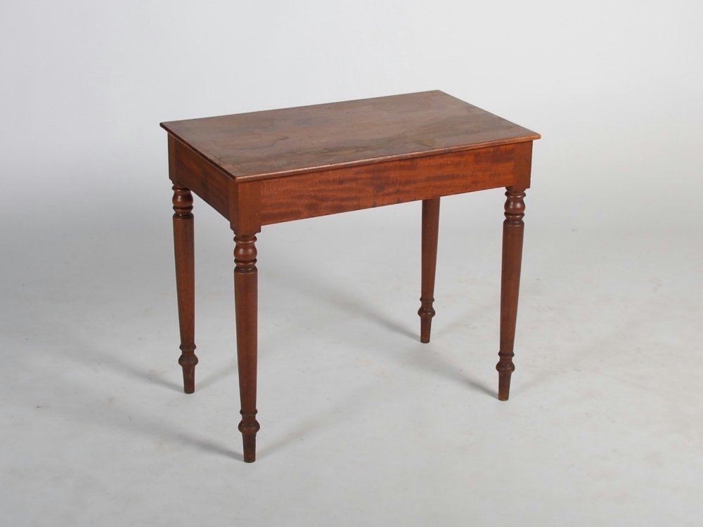 A Victorian mahogany side table, the rectangular top above a plain frieze, raised on four tapered