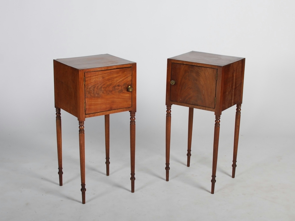 A pair of George III mahogany and ebony lined pot cupboards, the rectangular tops above single