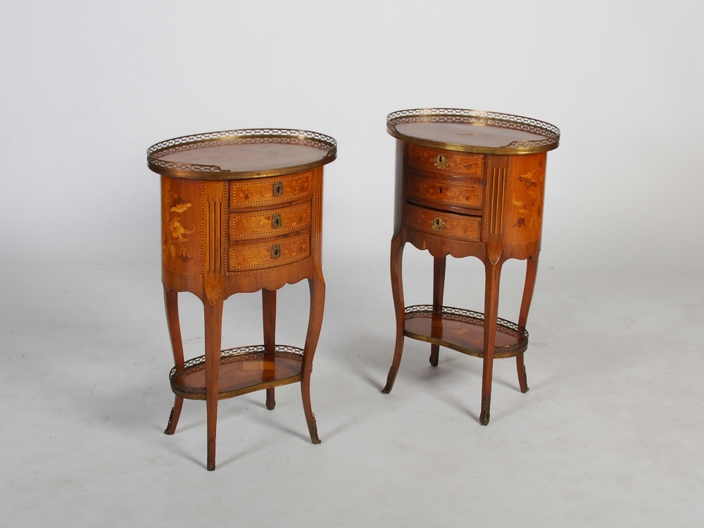 A pair of late 19th century French marquetry oval shaped occasional tables, the tops inlaid with