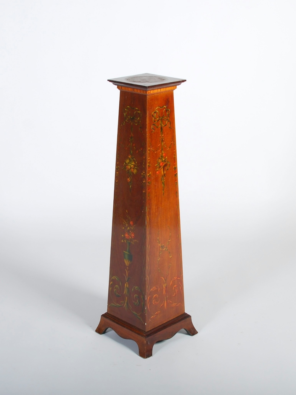 An Edwardian mahogany, satinwood and painted pedestal, the square top above a simulated dentil