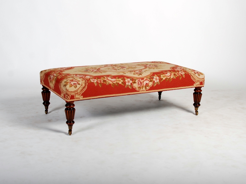 A William IV style mahogany and needlework rectangular stool, raised on four tapered reeded