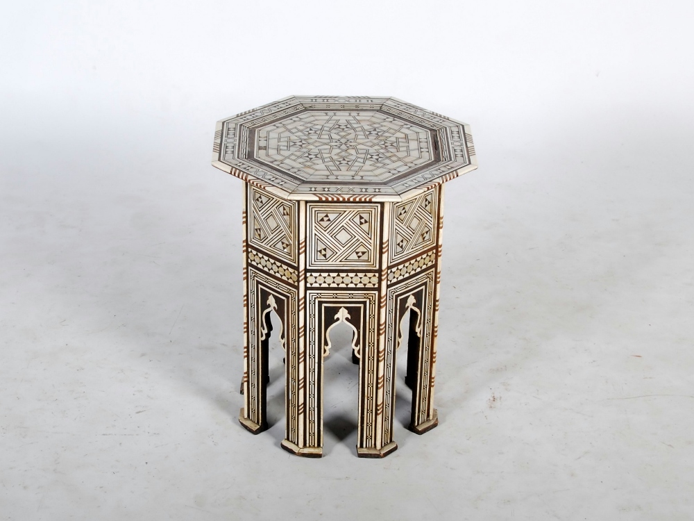 A late 19th century Eastern ivory and mother-of-pearl inlaid octagonal-shaped occasional table,