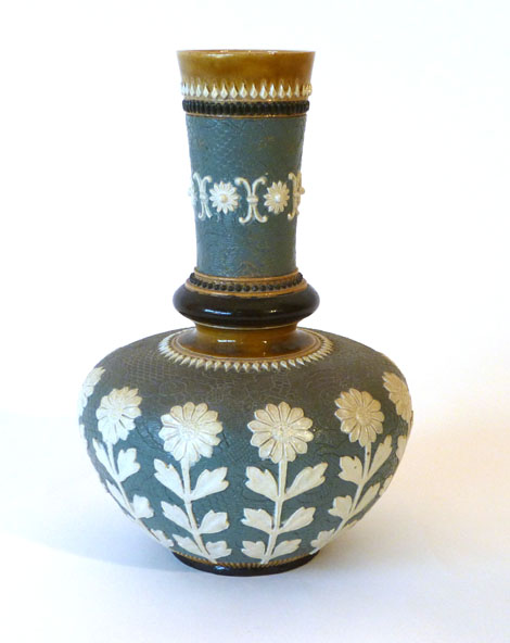 A Doulton Slater's Patent bottle vase, the grey body decorated with a band of stylised sunflowers,