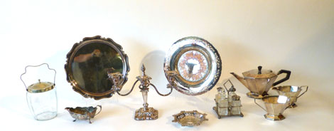 A group of platedwares including a three piece tea service, a two branch candelabrum and other