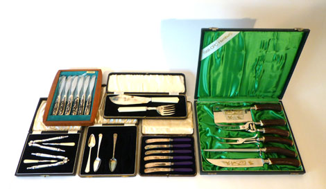 A group of plated wares including a cased set of nut crackers and picks and other items