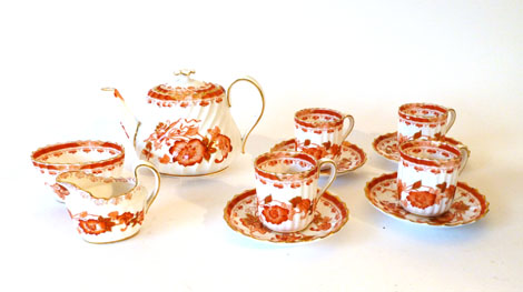 A Copeland part tea service decorated in gilt and iron red with scattered flowers  CONDITION REPORT: