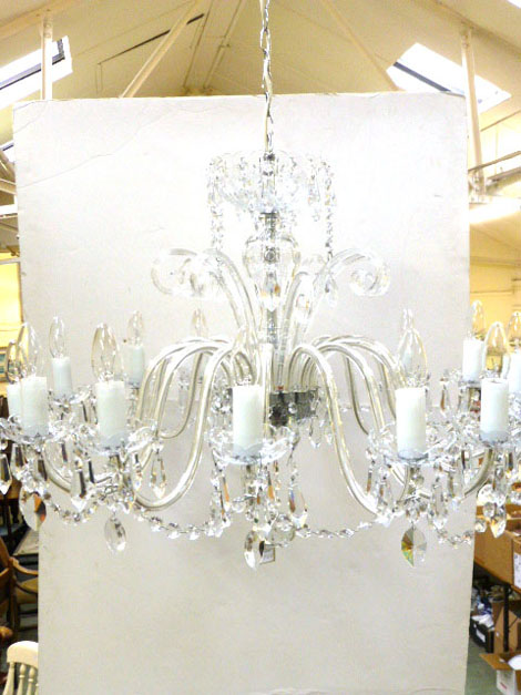 A 20th century chandelier with glass drops and electrical fittings CONDITION REPORT: Good