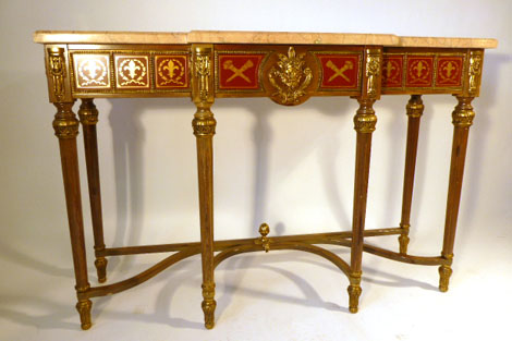 A Empire-Style marble topped and parcel gilt side table of breakfront form, the frieze set with tole