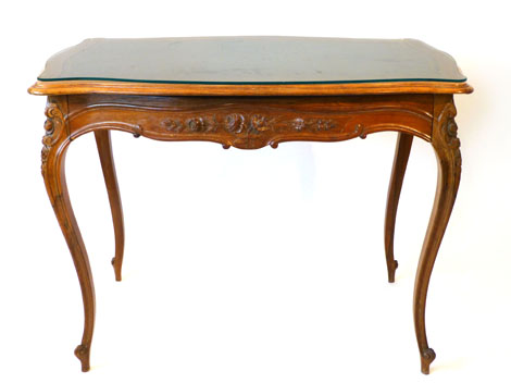 A 19th century continental rosewood centre table with frieze drawer and tooled green leather inset