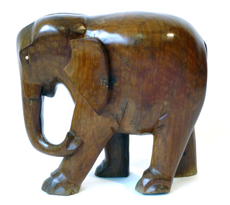 An African hardwood carved model of an elephant, h. 54cm  CONDITION REPORT: Wear commensurate with