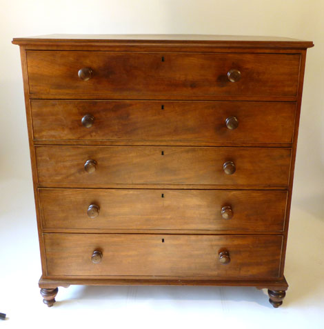 A Victorian mahogany chest of five long drawers with turned handles on bottle feet, w119cm x d.57