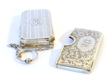 A George VI silver money case of rectangular form with engine turned linear decoration, lid