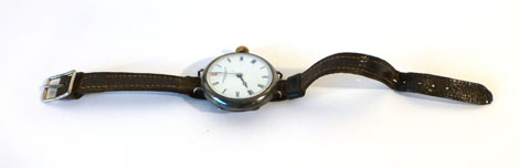 A gentleman's silver cased wristwatch having black Roman numerals on a white ground, retailed