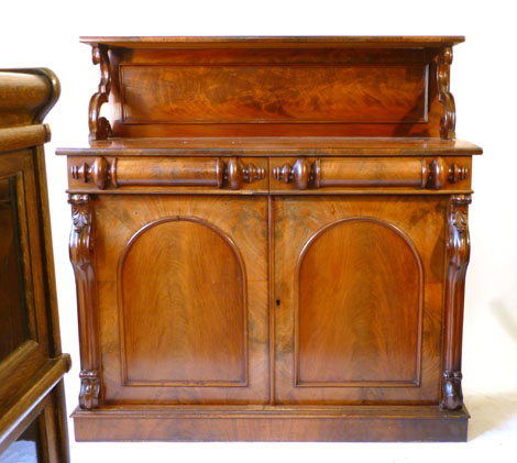 A Victorian mahogany chiffonier with galleried top on scroll supports, the base with a pair of