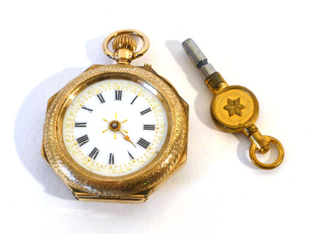 A lady's engraved 9ct gold fob watch having enamelled back in the form of a flower spray in green