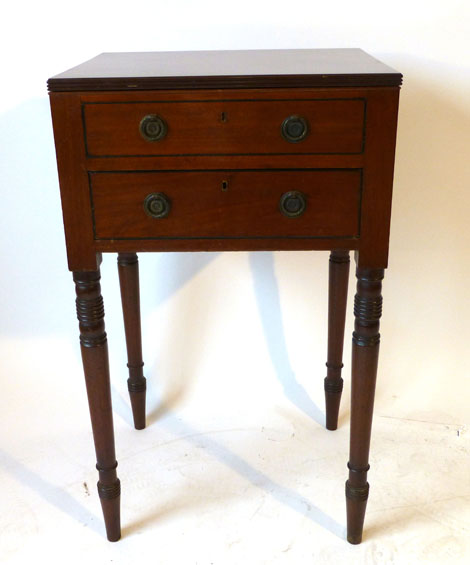 A 19th century mahogany cabinet table of rectangular form with lift up lid and single drawer on