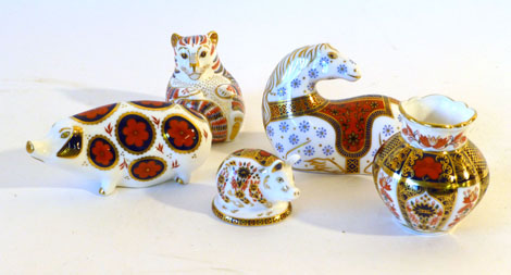Four Royal Crown Derby Imari paperweights including a horse lying down, looking behind it, a cat
