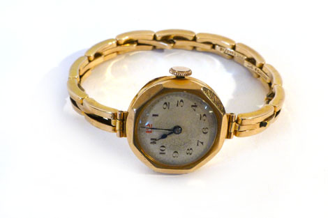 A lady's 9ct gold cased wristwatch having manual wind movement, black Arabic numerals on a