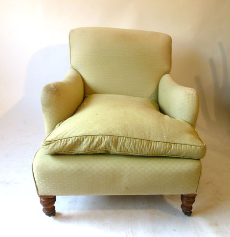 A Howard armchair upholstered in woven green fabric on turned walnut legs, stamped 14487 2890 Howard