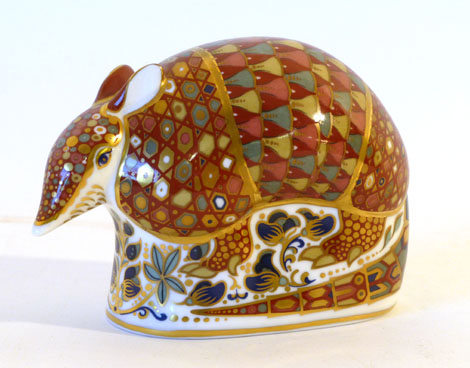 A Royal Crown Derby Imari paperweight Armadillo with gold button, h8cm